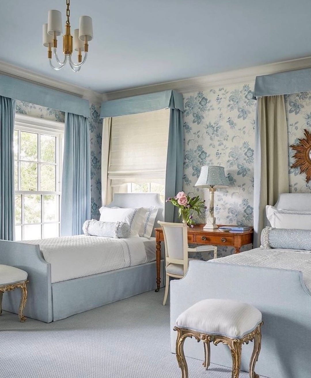 Coastal blues and floral accents create a serene bedroom design
