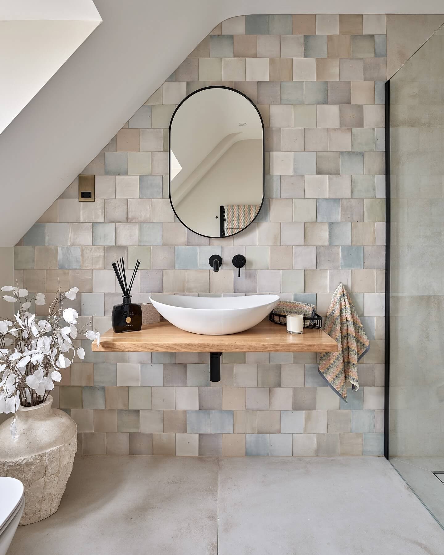 Elegant tiled feature wall enhances modern bathroom design