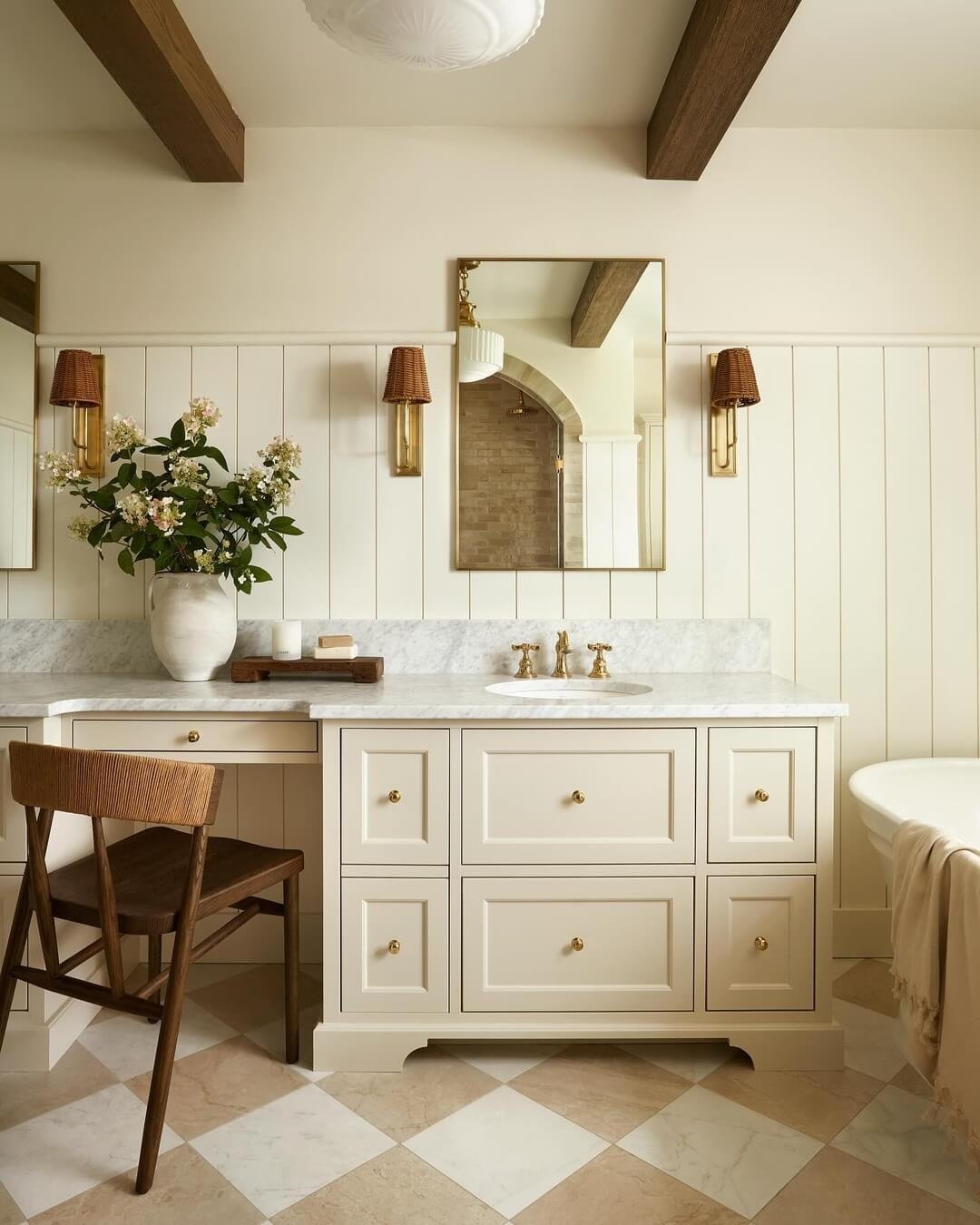 Elegant beadboard wall enhances warm creamy cabinetry