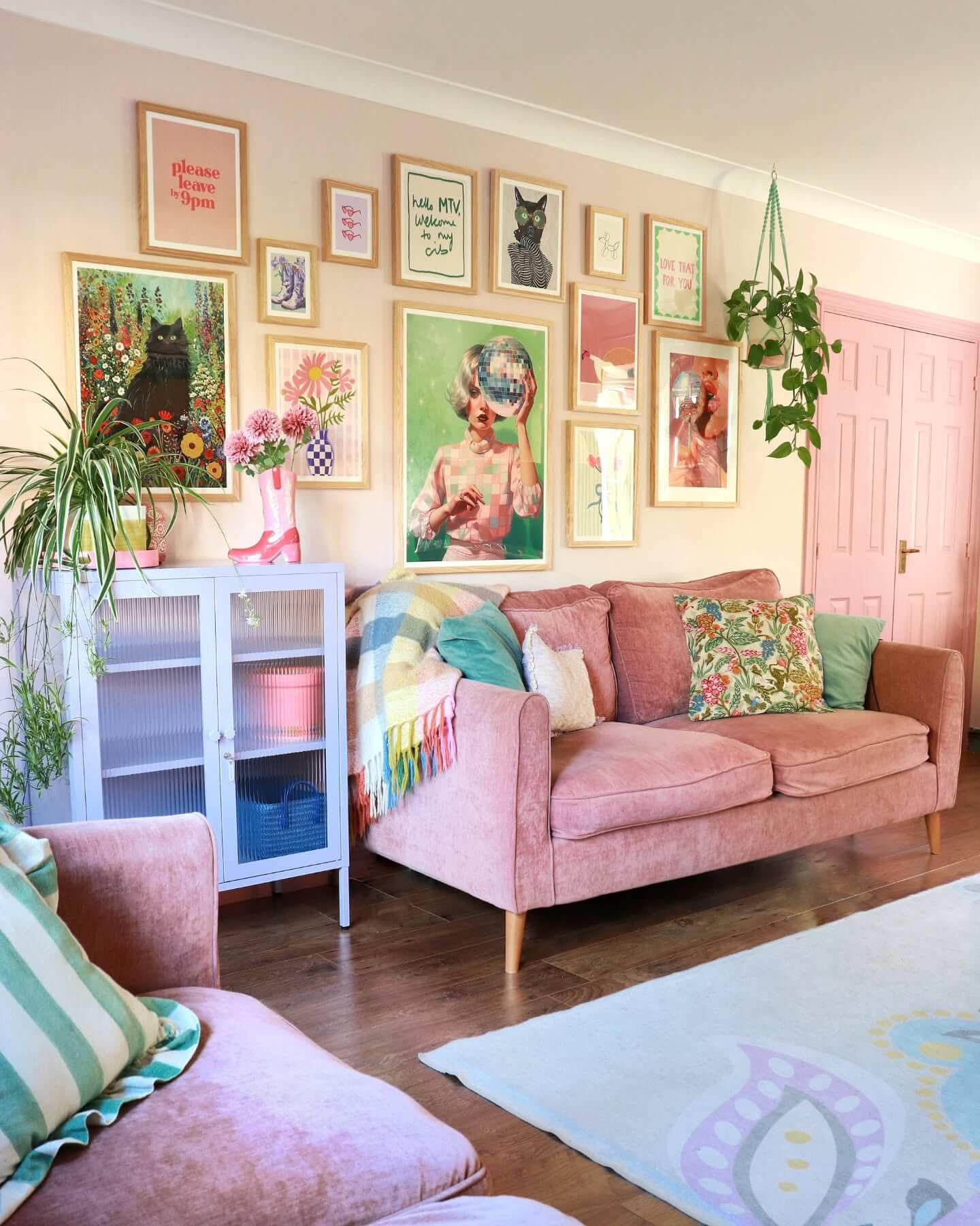 Cozy living room design with soft sofas and vibrant art