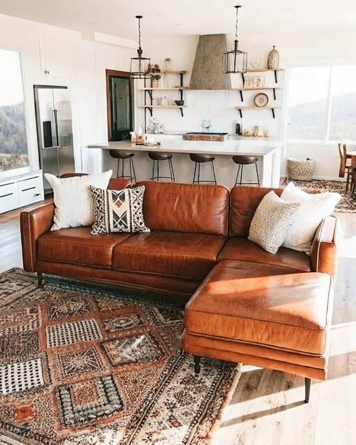 Stylish living room design with leather sofa and decor elements